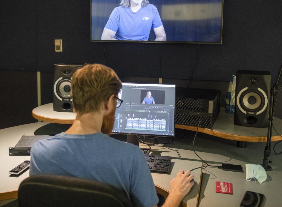 Broadcasting - Television and Film Production student editing video in studio