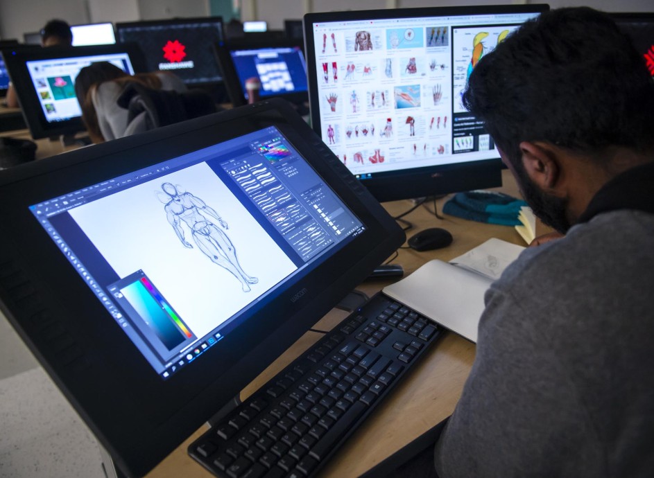  3D Animation and Character Design student working in computer lab