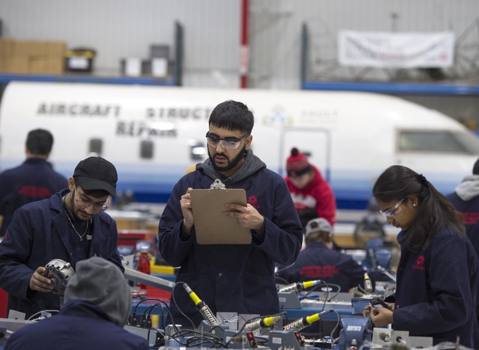 Aircraft Structural Repair Technician students working at the Jazz Hangar at Fanshawe College