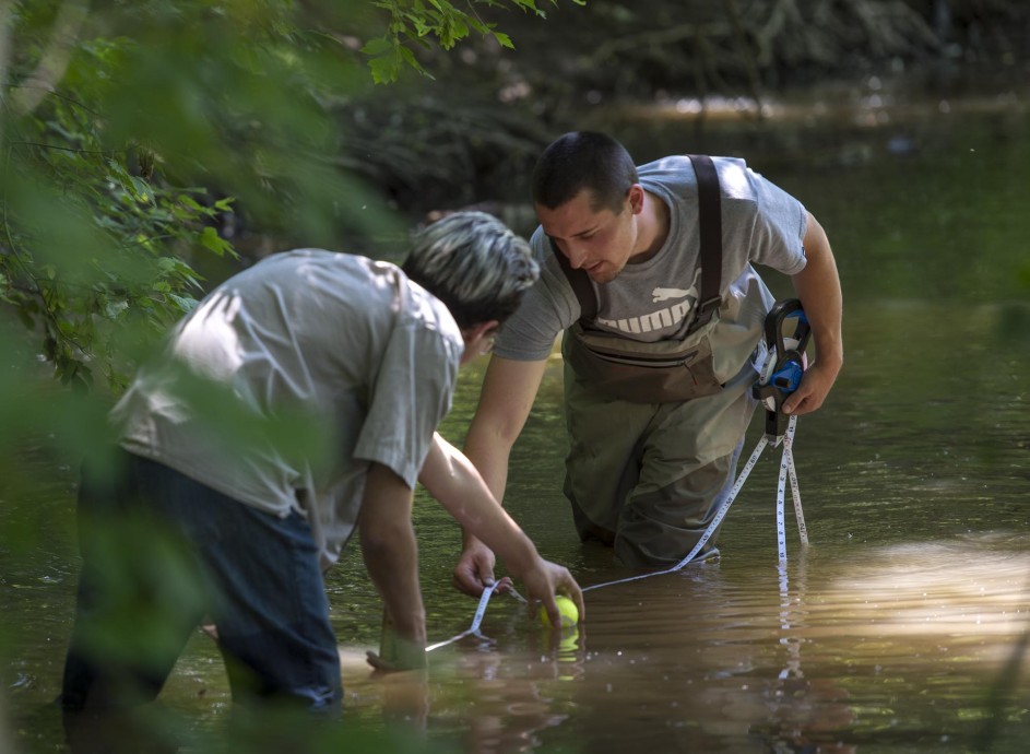 Two Environmental Technology students, taking samples in Stoney Creek