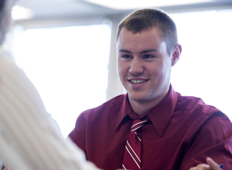 Business student smiling in classroom setting 