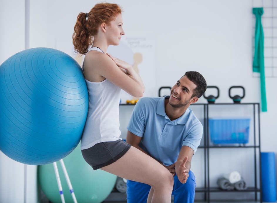 Occupational health therapist with a client showing her exercises