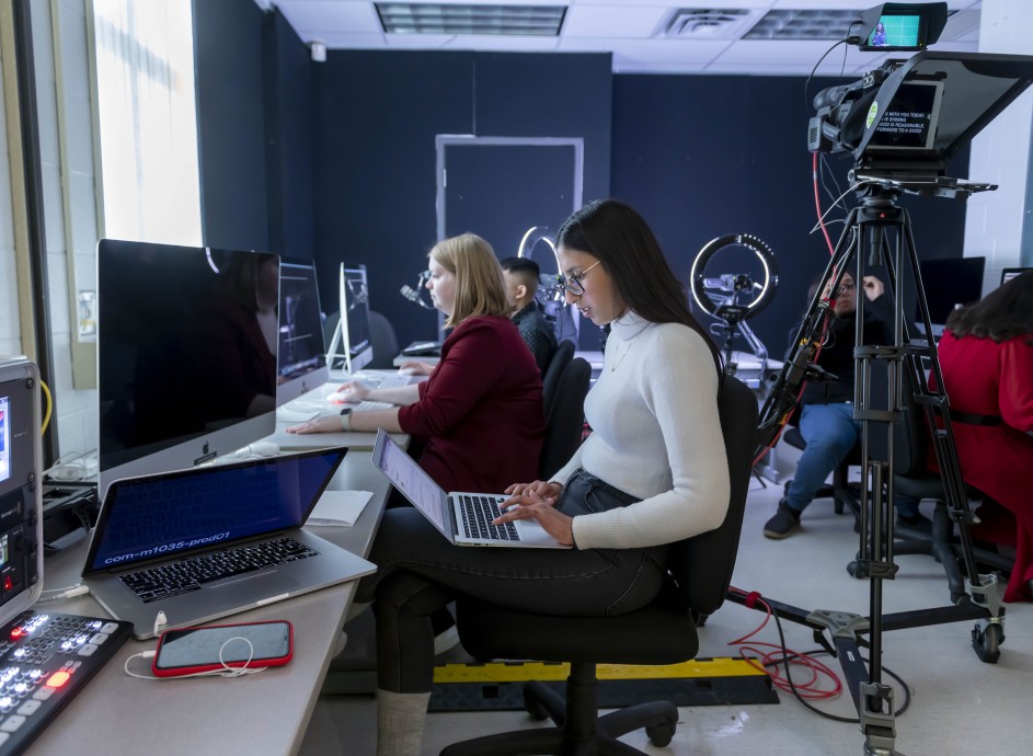 student in a broadcasting class room
