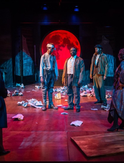 Theatre Arts students, acting on stage in Drums in the Night play