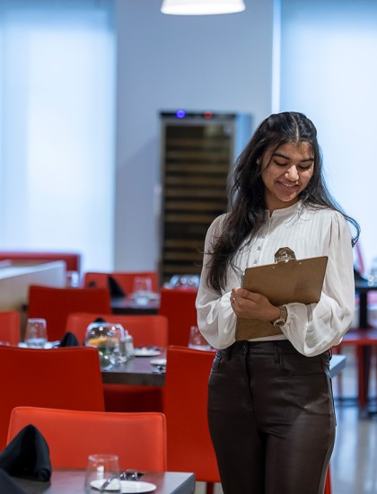 Photo of a Nutrition and Food Service Management student at Chef's Table Restaurant
