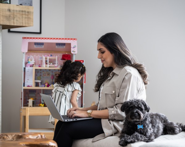 Photo of a student working in their living room