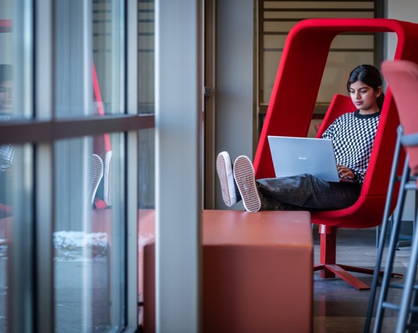 a student is using her laptop