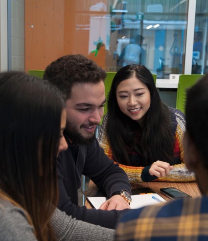 Four students studying at a table