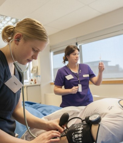 Fanshawe nursing student checking on dummy patient