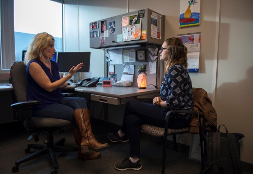 Student talking to counsellor in an office