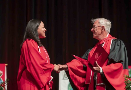Student accepting diploma on stage at graduation