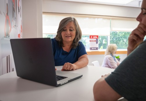 woman in co-op advisory meeting on laptop
