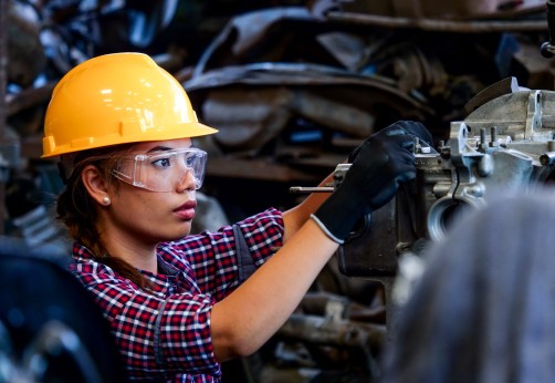 woman works with machinery