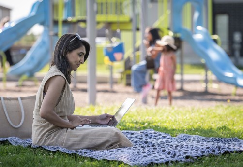 Adeeba on her laptop at the park