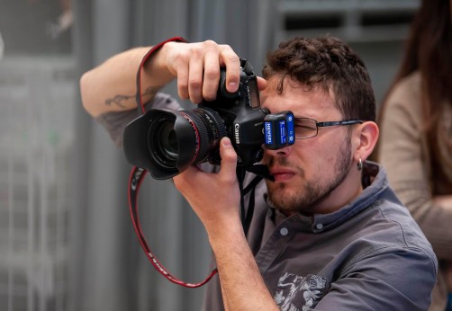 Up close photo of a person using a digital camera