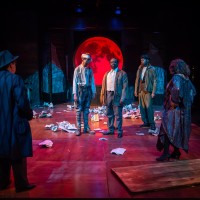 Theatre Arts students, acting on stage in Drums in the Night play