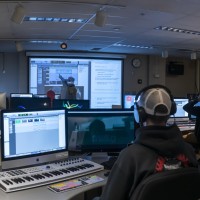 Students in class with professor at white board in audio post-production computer at Fanshawe Collegelab