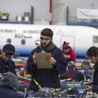 Aircraft Structural Repair Technician students working at the Jazz Hangar at Fanshawe College