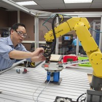 Instructor teaching class in Electrical Technician lab
