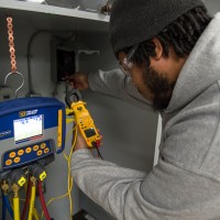 Student working on HVAC system