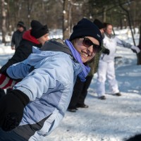 Recreation student on an outdoor trip holding hands with a group circle