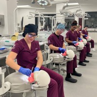 Photo of dental hygiene students working in the lab