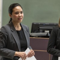 Two female student presenting their Operations projects to their class.