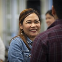 A female student networking at a Supply Chain Management event