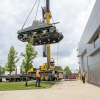 The Holy Roller tank being lowered by a crane