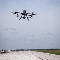 A drone flying over the runway