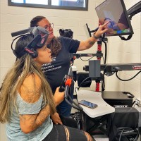 Women of steel participant working on an AI welding machine
