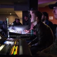 Photo of a music industry professional watching a concert