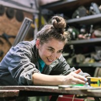 woman works with level