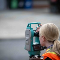 Fanshawe student using an optical level kit