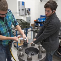 People Working on Wind Tourbine Part