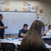 PAI classroom photo of a professor presenting