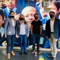 four members of the team pose together