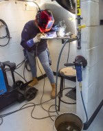 student welding at work station