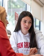 student points at screen while getting support from career services consultant