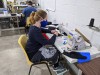 Workers manufacture "The Worker" face masks through a joint research project by Goodwill Industries and Fanshawe College’s Centre for Research and Innovation