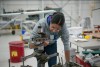 Student works on machinery at the Norton Wolf School of Aviation Technology