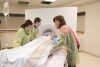 Dummy patient surrounded by Fanshawe nursing students