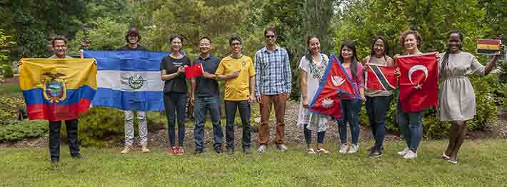 International students holding flags from their countries