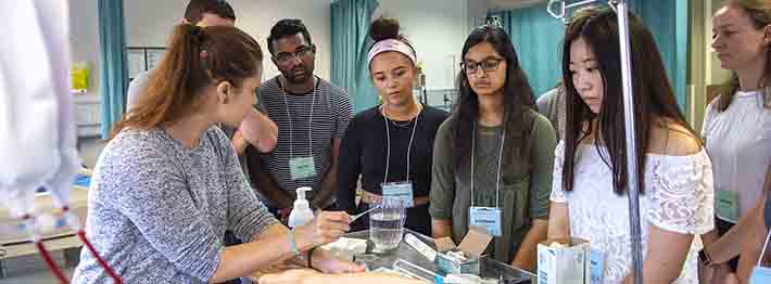 students observing medical procedure